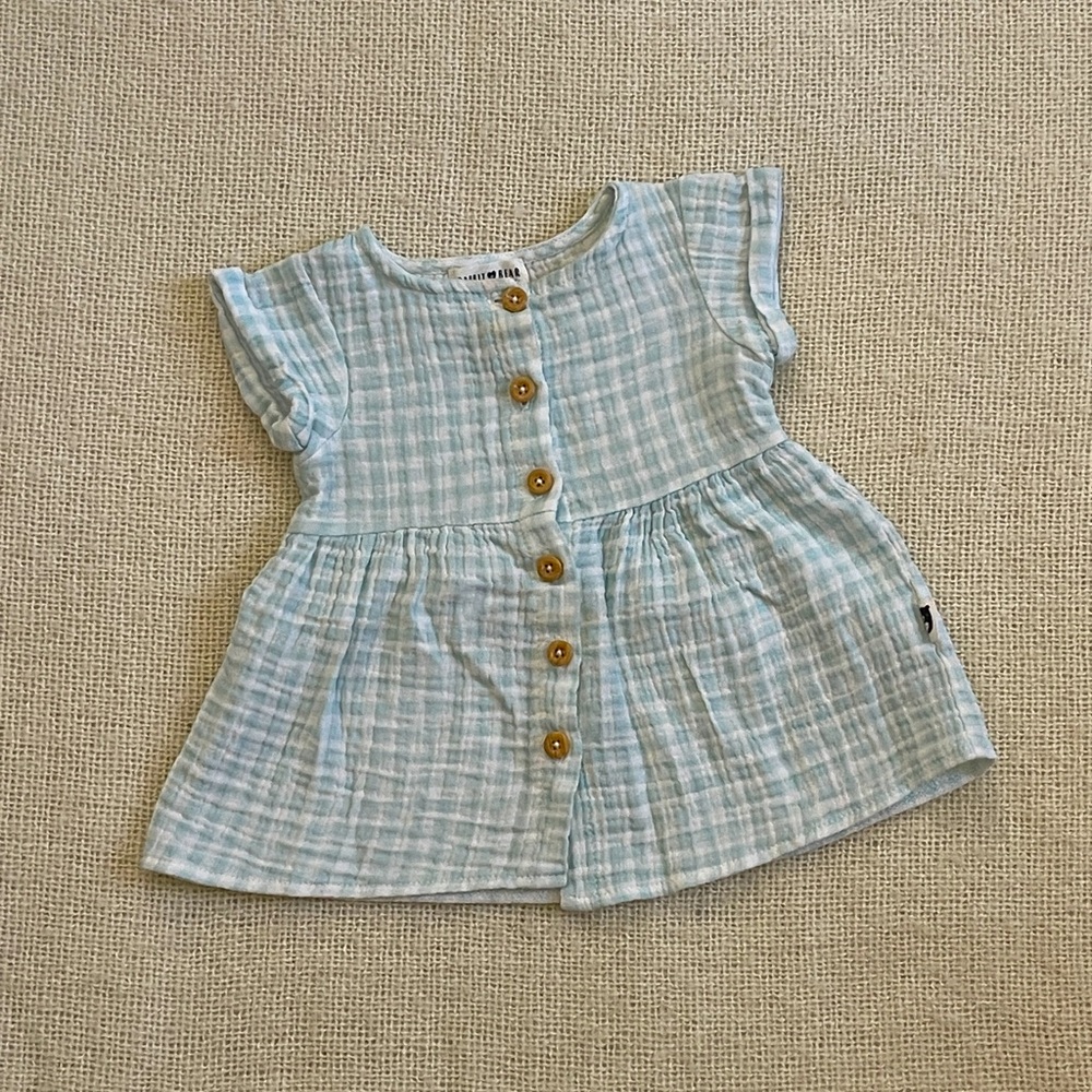 Baby girl clothes. Light blue peplum style top with button down. 12 months.